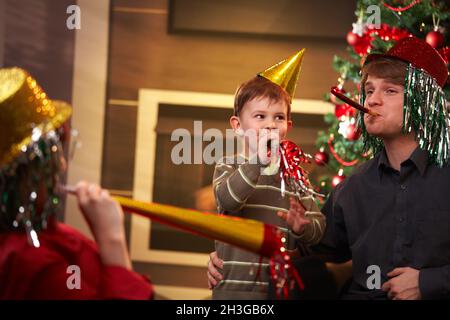Happy family celebrating new year's eve together Stock Photo