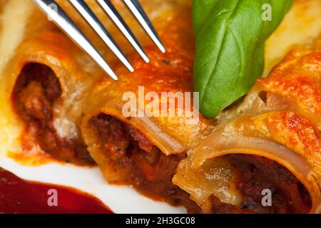 Cannelloni, traditional pasta with tomato sauce Stock Photo