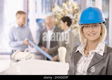 Portrait of female designer in hardhat Stock Photo