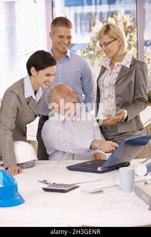 Happy businessteam busy at work Stock Photo