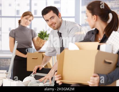 Young group of office workers moving to new office Stock Photo