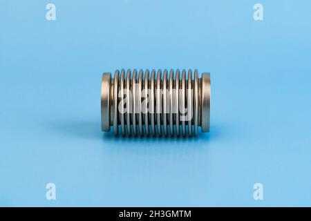 Sylphon isolated isolated on blue background. Metal bellows. Used on High quality photo Stock Photo