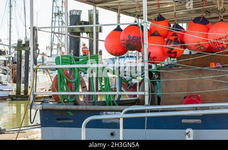 Buoys tied to back side of a fishing boat. Colorful buoys hanging on a fishing boat. Selective focus, travel photo, nobody, concept photo fishing indu Stock Photo