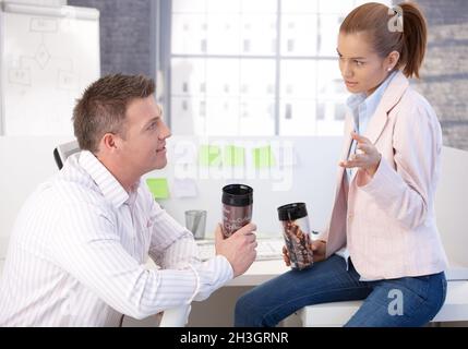 Casual office workers having coffee break chatting Stock Photo