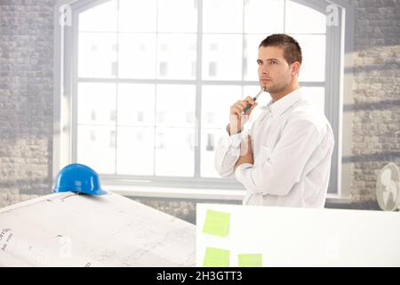 Goodlooking architect making plans Stock Photo