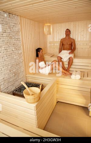 Couple relaxing in sauna Stock Photo