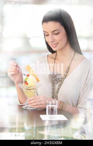 Pretty woman enjoying ice cream Stock Photo