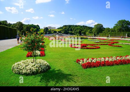 Vienna Austria - September 4 2017; Great Parterre or landscaped green and patterned flower garden area in Schronbrunn Palace grounds