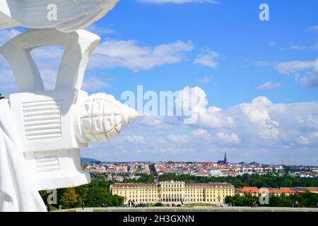 Vienna Austria - September 4 2017;  view of the palace and city beyond from the Gloriette framed on left by portion of sculpture Stock Photo