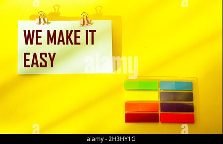 We make it easy The text is written on a sticker and a yellow background Stock Photo