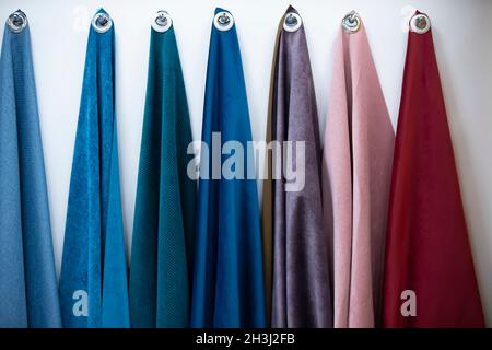 Samples of fabrics for sewing furniture on a white background. Stock Photo