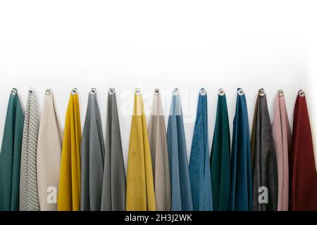 Samples of fabrics for sewing furniture on a white background. Stock Photo