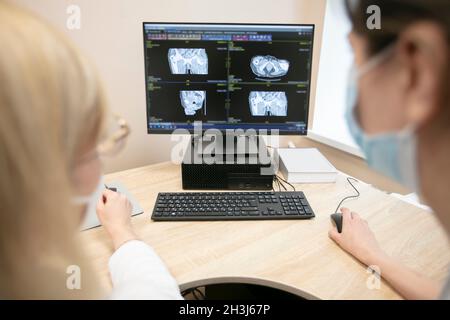 Doctors review the tomography results in a computer. Belarus, Gomel, May 30, 2021 Central Hospital.Discussion of the patient's diagnosis. Medical pict Stock Photo