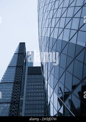 Underside angle view to textured background of contemporary glass building skyscrapers Stock Photo