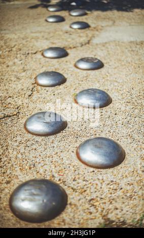 Traffic safety speed bump on an asphalt road Stock Photo