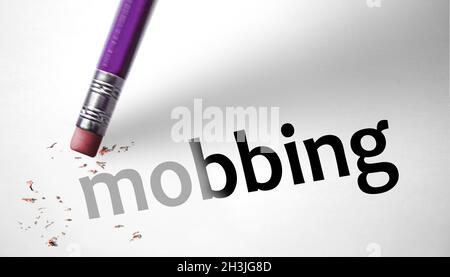 Eraser deleting the word Mobbing Stock Photo