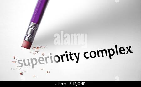 Eraser deleting the concept Superiority Complex Stock Photo