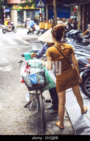 Hanoi, Vietnam - May 2, 2015: Vietnamese street market seller, on May 2, 2015, in Hanoi, Vietnam