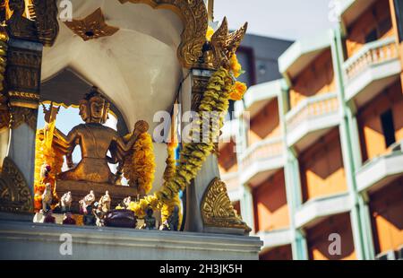 Phra Phrom altar in Bangkok street. Phra Phrom is the Thai representation of the Hindu god Brahma Stock Photo