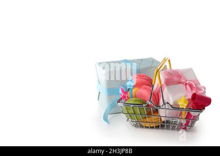 Gift box and shop basket with birthday accessories isolated on white background Stock Photo