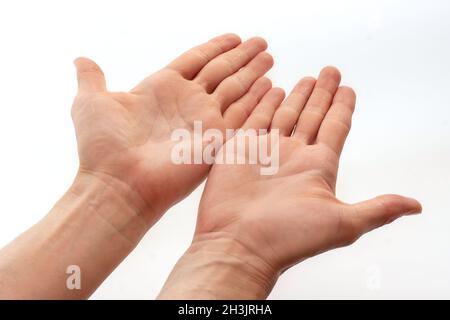 Two open empty men's hands isolated on white background. Top view Stock Photo