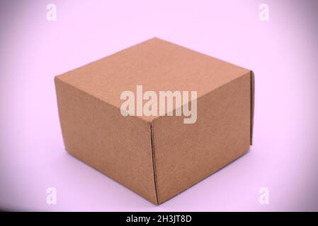 Box packaging in a pink background. Stock Photo