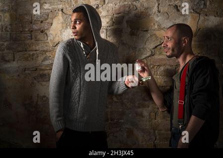 Drug addict buying narcotics and drugs Stock Photo