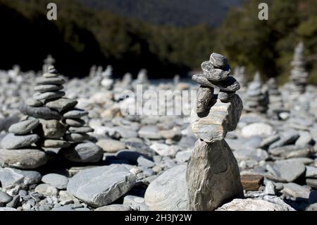 Rock cairns at Makarora river, South Island, New Zealand Stock Photo