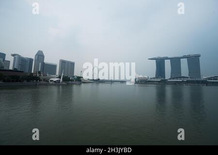 View of Art Science Museum, Marina Bay Sands and Ferris Wheel in Singapore Stock Photo