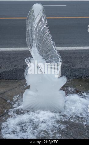 Carving an ice sculpture with a chainsaw Stock Photo - Alamy