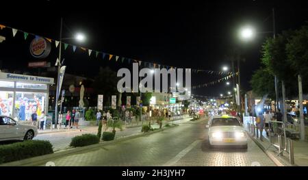 Ayia Napa, Cyprus - 14 October, 2021: One of the central streets of Ayia Napa. There are always a lot of people here. Modern shops and the best restau Stock Photo