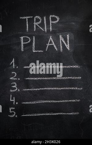 Trip plan list on black chalkboard Stock Photo