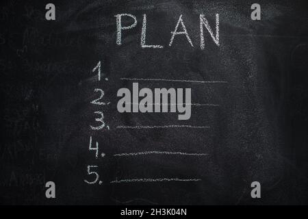 Plan list on black chalkboard Stock Photo