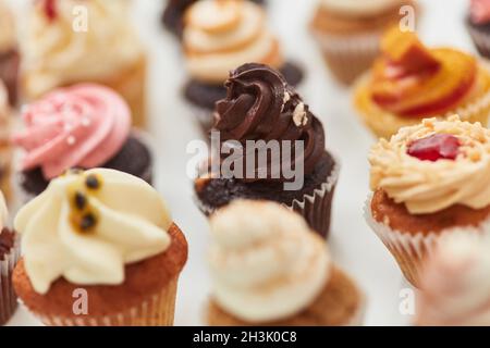 Different colorful small cupcakes and muffins for birthday Stock Photo