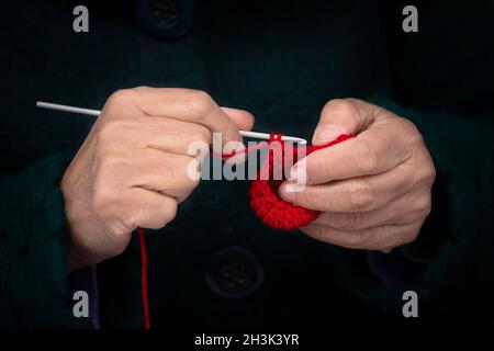 Italy, Lombardy, Close Up of Old Woman Knitting Stock Photo
