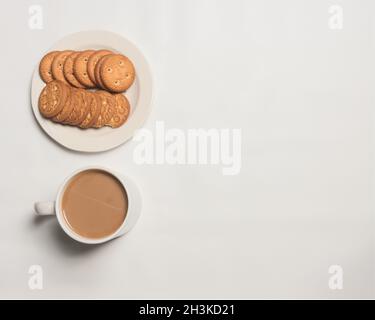 flat lay coffee with cookies in white Stock Photo