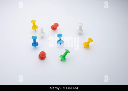 Set of push pins in different colors. Thumbtacks. Top view. Vector illustration. Isolated on white background. Set Stock Photo