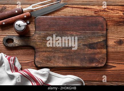 Empty cutting board on a wood table Stock Photo
