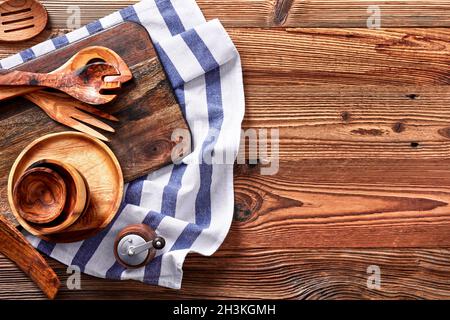 Kitchen utensils and towel on a wooden table Stock Photo