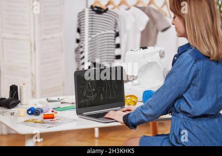 Young seamstress woman in her workshop Stock Photo