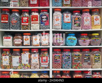 Jars of old fashioned traditional british sweets in on display in the window of a shop Stock Photo