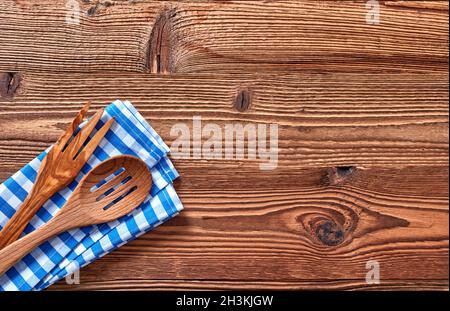 Kitchen utensils and towel on a wooden table Stock Photo