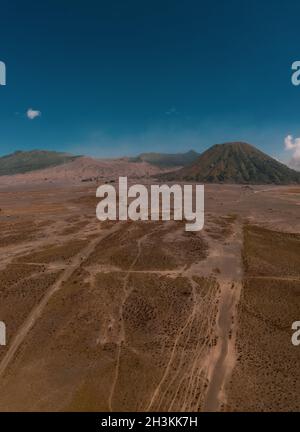 Cinematic shot view of beautiful Mount Bromo volcano with desert in East Java Stock Photo