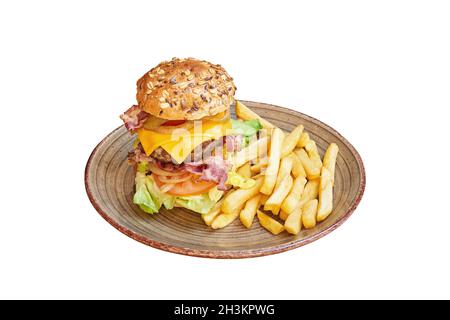 Big hamburger and french fries on plate. Isolated on white with clipping path Stock Photo