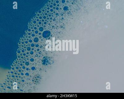 Semi-abstract picture of the pattern of white bubbles against a blue background Stock Photo
