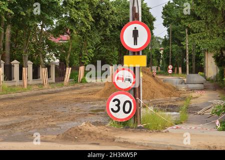 Prohibition signs set on a renovated road. No pedestrian crossing. Stock Photo