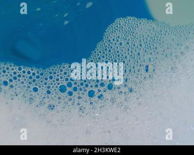 Semi-abstract picture of the pattern of white bubbles against a blue background Stock Photo