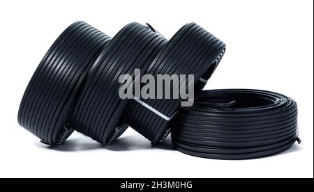 Coils of black cable isolated on white background Stock Photo