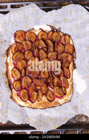 Bavarian plum-dachi on dark wood Stock Photo