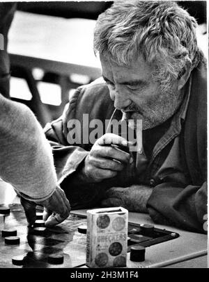 Old man playing checkers in MacArthur's Park in Los Angles from Jimmy Webb's record by Richard Harris of the late 60's Stock Photo